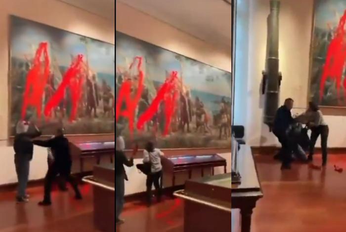 Dos activistas lanzan pintura roja contra un cuadro de Colón en Museo de Madrid