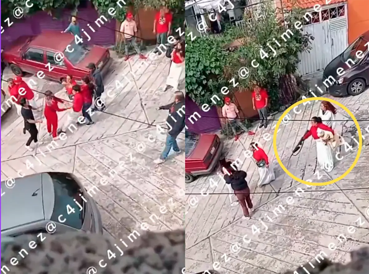 #Video: Mujer saca arma en riña vecinal de Naucalpan mientras carga a su bebé
